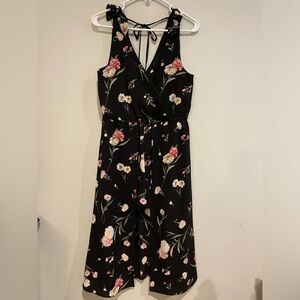 Adorable Trixxi black floral romper with long skirt detail. Size M